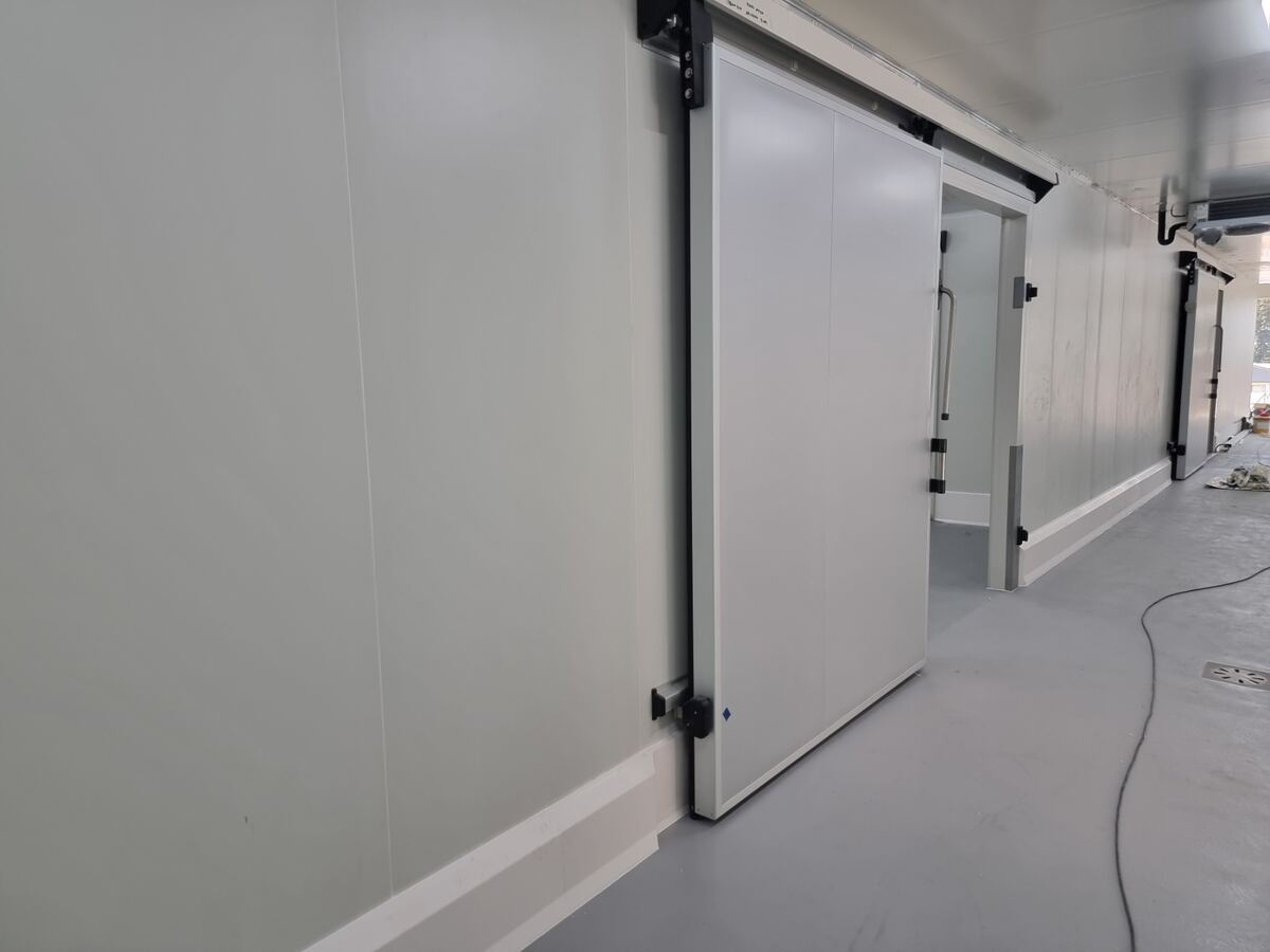 Insulated sliding cold room door installed in corridor